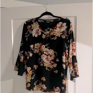 Navy blue floral colored blouse with bell sleeves